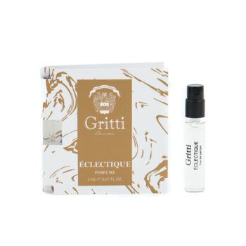 Gritti Éclectique perfume set: white patterned box with a gold label and a small spray bottle beside it, on white background.