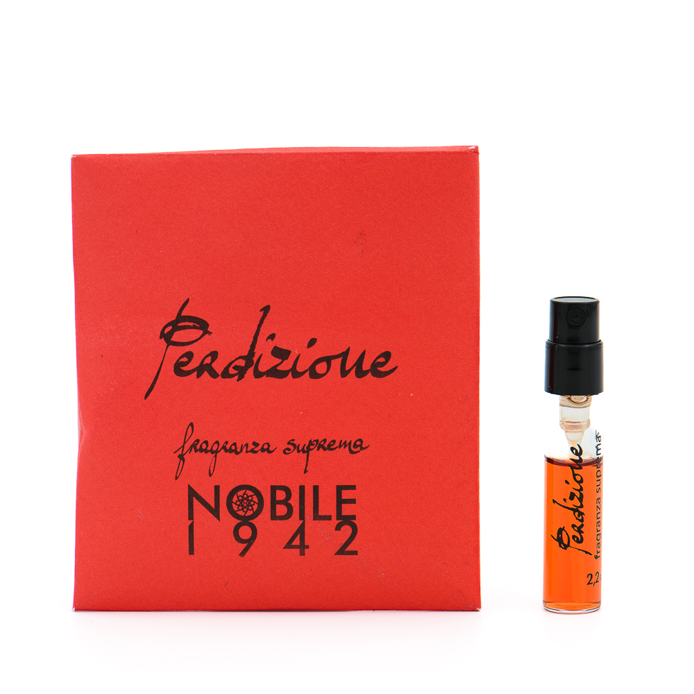 Red perfume box labeled 'Perfume Noble 1942' beside a small clear vial with orange liquid and a black spray cap.