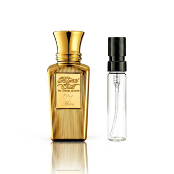 Two perfume bottles—one gold ornate bottle and a clear spray bottle—standing side by side on a white background.