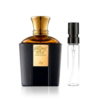 Dark ribbed perfume bottle with gold cap and a gold label reading 'Blend Oud Private Collection Joy', plus a clear spray bottle beside it on white background.
