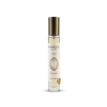 Narrow glass perfume bottle with a gold cap, white label reading Masque Milano L'Attesa and a vintage clock illustration on the front.