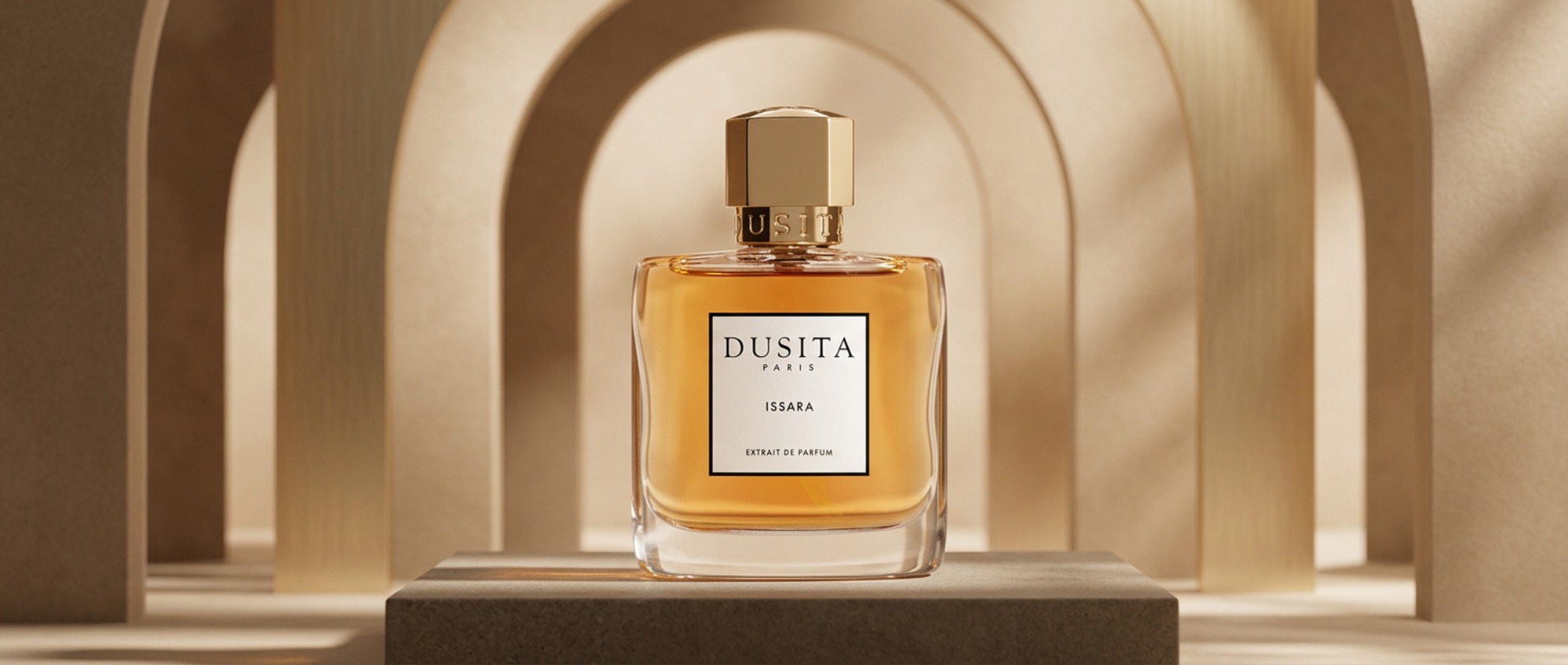 Perfume bottle labeled DUSITA PARIS ISSARA on a pedestal with warm beige arch backdrop behind it.