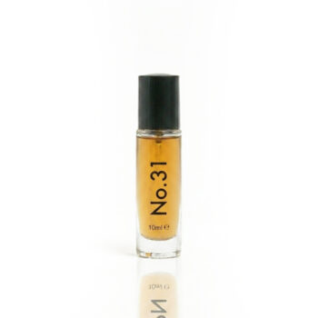 Small amber perfume bottle labeled No.31 with a black cap and '10 ml' on the front, standing upright on a white background.