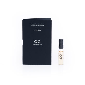 Black packaging with 'Mirko Buffini Firenze' and 'OG eau de parfum' beside a small clear spray bottle of perfume (OG).